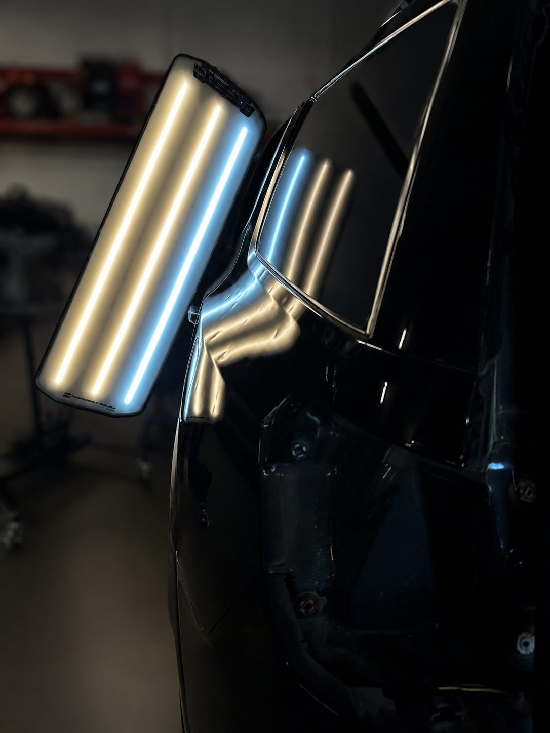 Dented black panel under the PDR light tunnel